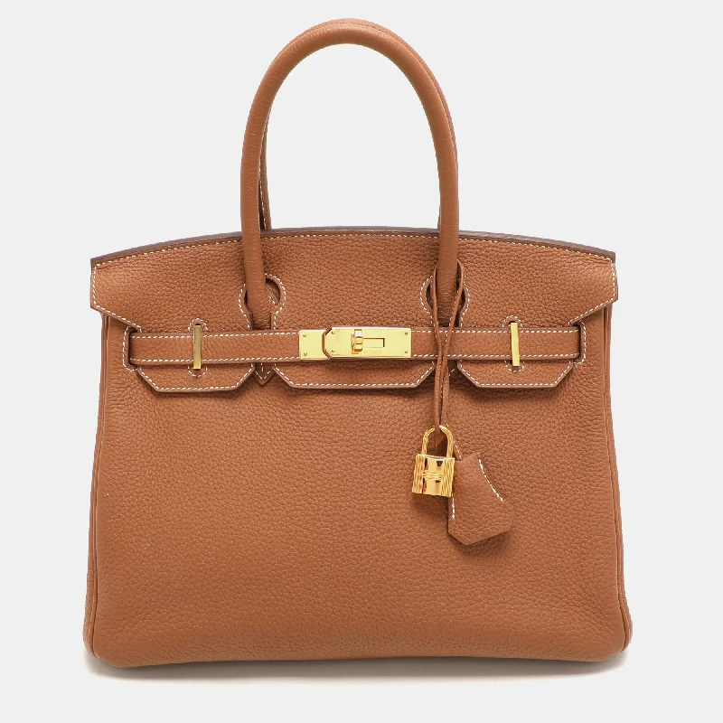 Handle bags with metallic finishes for shine -Hermès Gold Togo Leather Gold Finish Birkin 30 Bag