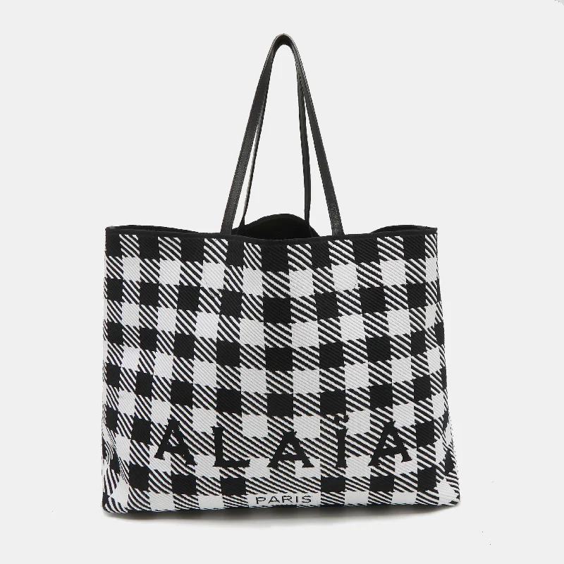 Handle bags with sleek black for elegance -Alaia Black/white Canvas And Leather Large Houndstooth Tote