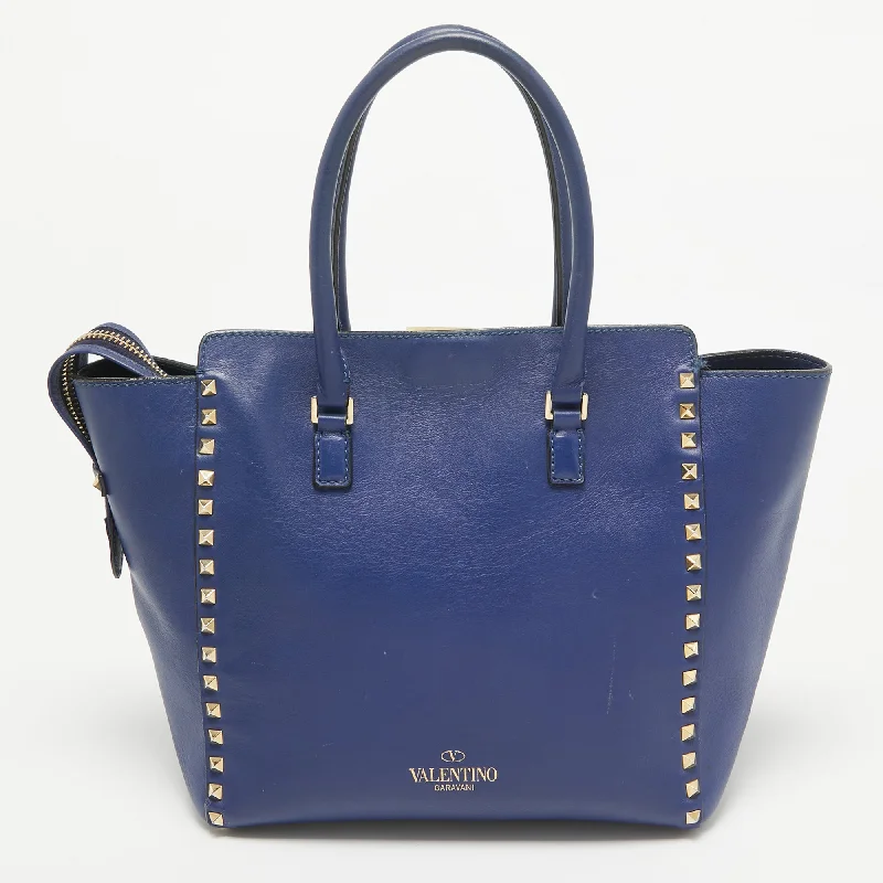 Handle bags with bright neons for visibility -Valentino Blue Leather Rockstud Trapeze Tote