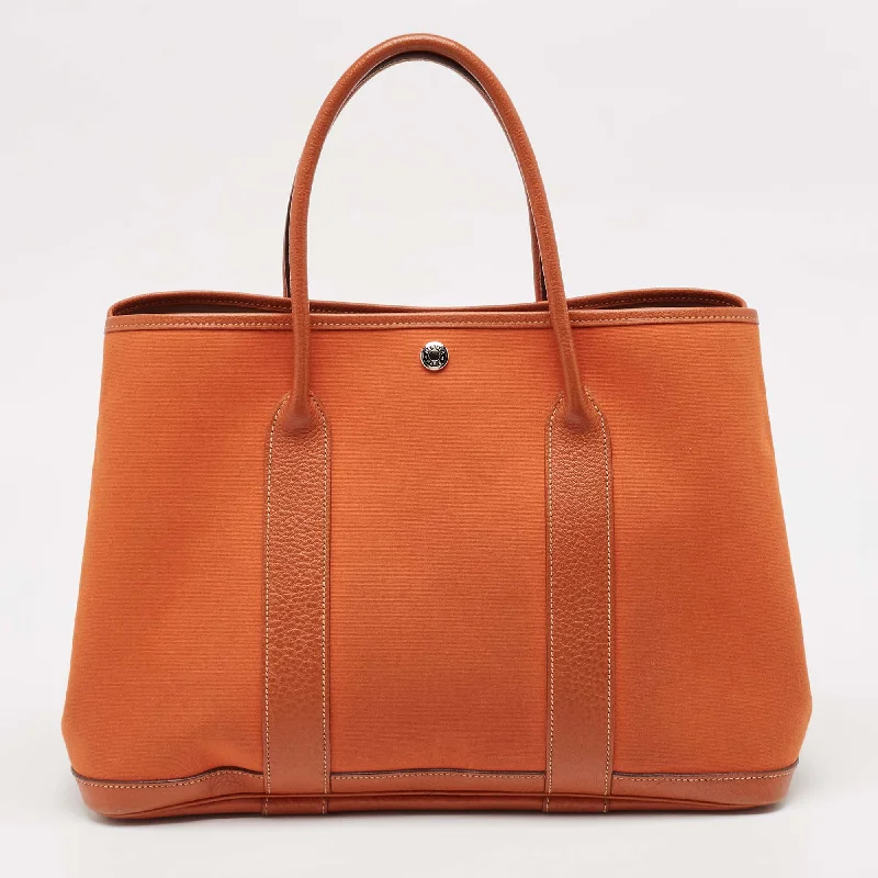 Handle bags with modern cutouts for style -Hermes Potiron Toile And Negonda Leather Garden Party 36 Bag