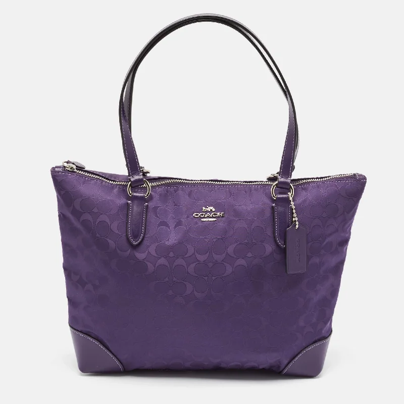 Handle bags with bold text for statements -Coach Purple Signature Nylon And Leather Zip Top Tote