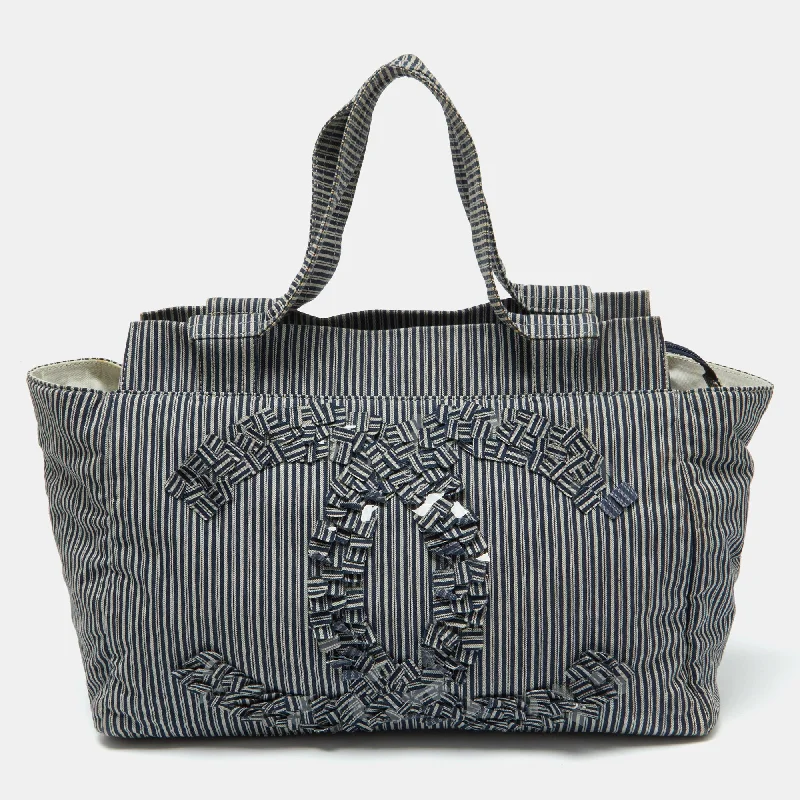 Handle bags with spacious pockets for travel -Chanel Chambray Blue/white Canvas Cc Striped Shopper Tote