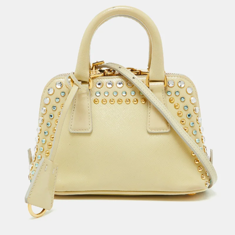 Handle bags with geometric patterns for modernity -Prada Cream Saffiano Patent Leather Crystal Embellished Pyramid Frame Satchel